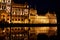 A fabulous nighttime photo of the illuminated facade of the parliament building in Budapest, reflected in the water