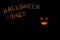 Fabulous pumpkin and inscription Halloween in the darkness