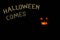 Fabulous pumpkins and inscription Halloween in the darkness