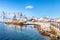 Fabulous winter view of Sakrisoy village and snowy mountaines on background