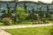 The facade of the academic buildings of The international College, covered hanging gardens of climbing plants in the suburbs o