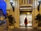 Facade of Accor Mercure Hotel in central Nice with lonely woman entering the