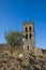 Facade of Almonaster la Real Mosque in Spain against a blue sky on a sunny day