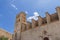 Facade of Almudaina Castle in Eivissa shows medieval architecture under a clear sky