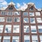 Facade of the Amsterdam17th century residence building in the midday.
