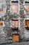 Facade of ancient building with window boxes in old Quebec City.