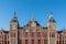 Facade of the ancient central train station in Amsterdam