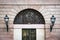 Facade of an ancient Italian villa with artistic iron grill.