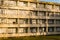 Facade of an apartment building at sunset