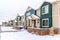 Facade of apartment homes amidst a snowy neighborhood scenery in winter