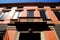 Facade with balconies and a lion\'s head in Padua in the Veneto (Italy)