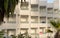 Facade with balconies of a white tourist hotel