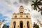 Facade of basilica in honour of Our Lady of Charity with palm, El Cobre, Santiago de Cuba, Cuba