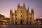 Facade of the beautiful historic Duomo building at night.