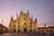 Facade of the beautiful historic Duomo building at night.