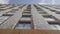 The facade of brick high-rise apartment buildings with stained glass windows.