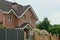 facade of a brown brick private house with windows