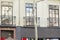 Facade of a building with balconies with wrought iron railings and French windows