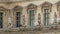 The facade of a building with male statues in the vicinity of the Louvre timelapse, Paris, France.