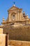 Facade of the Cathedral of the Assumption behind massive walls of the Cittadella of Victoria in Gozo, Malta