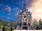 facade of Cathedral of Sacred Heart of Jesus on background of a morning sky at sunrise in spring. Roman Catholic Church