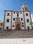 Facade of church of La Merced at square in european city center of Ronda in Spain - vertical