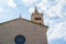 Facade of Church of St. Anthony with the tower and cloudy sky at the background, in Pula, Croatia