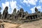 Facade and courtyard of Bayon Temple in Cambodia