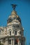 Facade decoration on old building with golden dome in Madrid