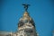 Facade decoration on old building with golden dome in Madrid