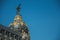 Facade decoration on old building with golden dome in Madrid