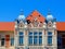 Facade detail of old building in secession style with zink cupolas and ornate windows.