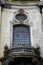 Facade of the Dominican Cathedral, Lviv, Ukraine. Fragment window with metal gril and balcony. Close up.