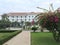 Facade of famous historic Raffles Grand Hotel Dâ€™Angkor building and its park