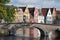 Facade of flemish houses and canal in Brugge