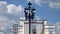 Facade of Four Seasons hotel Hotel Moskva from Manege Square on a cloud background. Moscow, Russia