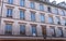 The facade of french building modern style with windows and french balconies