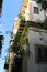 Facade of a historic building with a beautiful cloudless blue sky in the  historic center of Palermo in Italy