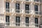 Facade of the historic flat house with balconies