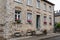 Facade of historical mansion house with flowered window sills. Alt Breinig, DE