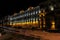 Facade of historical residential house on the one of the central street of the city tonight.