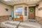 Facade of a home with a wooden bench on the welcoming front porch