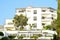 The facade of the hotel coral Bay Paphos, Cyprus, June 2017. Terraces, cvetochik with thickets of shrubs and trees