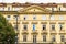 Facade of the house of classical European architecture of the old cozy tourist city. Background