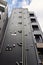 Facade of a Japanese residential building with external sewage pipes