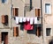 Facade with laundry. Street view of old town of Chioggia. Italy