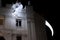 Facade of the main Theater of Zaragoza adorned with a luminous dragon at night