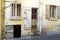 Facade with many doors and windows of a french building