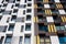 Facade of modern multi-storey residential building with air conditioner baskets