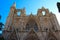 The facade of the Mosque Lala Mustafa Pasha mosque former St. Nicholas Cathedral on the background of blue sky. Famagusta.